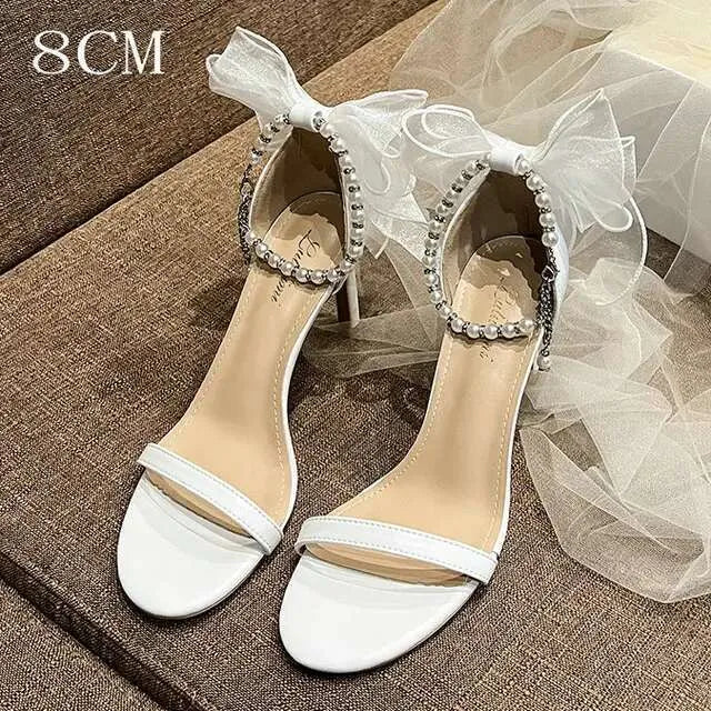 Summer New Round Head Sandals Pearl One Line Buckle White Bow High Heels Fairy Wind Female Wedding Shoes Kq8