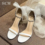 Summer New Round Head Sandals Pearl One Line Buckle White Bow High Heels Fairy Wind Female Wedding Shoes Kq8