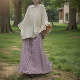 Shan Qian Nianyi, the spring new product has a simple design sense of A-shaped skirt, women's cotton and linen are quite wide, and the middle and long skirt with split ends.