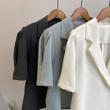 2025 summer short-sleeved suit retro pure bubble sleeve women's single-grain buckle loose Korean casual suit jacket 2140