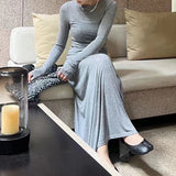 2025 In stock, this year's popular high-end suit, slim-fit solid-color long-sleeved T-shirt, bottoming shirt, pleated long skirt, two-piece set.