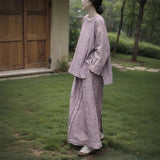 Shan Qian Nianyi, the spring new product has a simple design sense of A-shaped skirt, women's cotton and linen are quite wide, and the middle and long skirt with split ends.