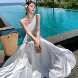 2025 super fairy white hollow slanted shoulder dress women's summer high-end temperament seaside vacation waist long skirt